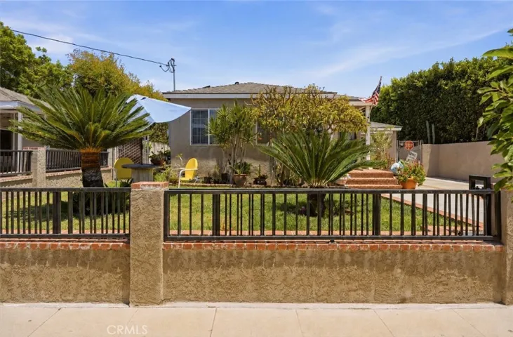 A beautifully landscaped front yard creates a warm and inviting first impression.