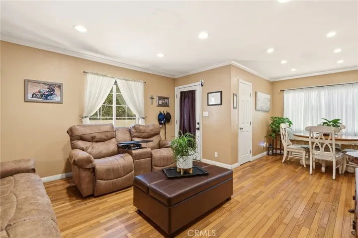 The living room flows into the dining area, creating a comfortable layout for everyday living and entertaining.