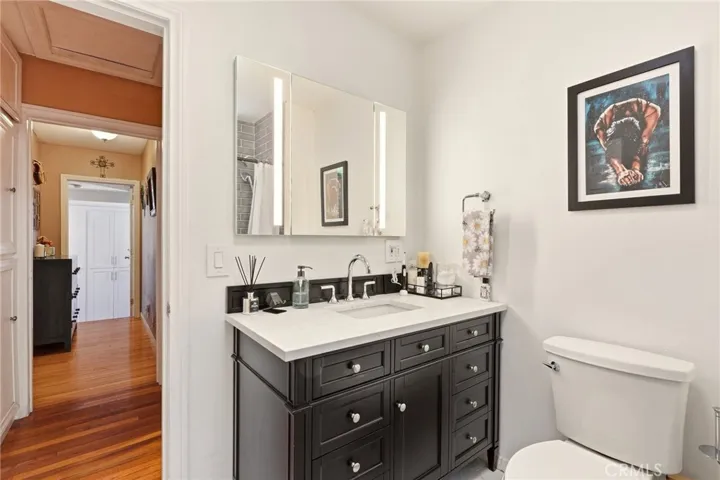 Beautifully remodeled bathroom featuring a modern vanity, lighted mirror, and contemporary finishes.