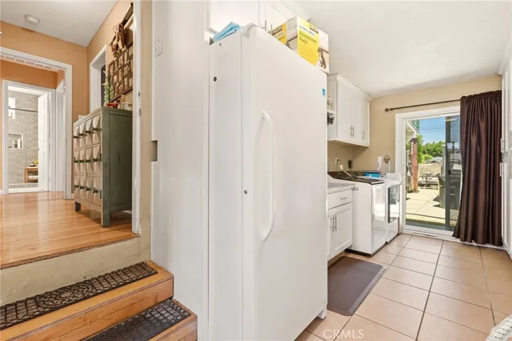 Spacious laundry room with convenient access to the backyard.