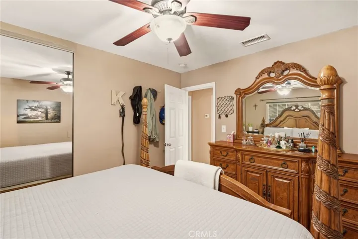 Floor to ceiling mirrored closet doors enhance both the style and storage of the primary bedroom.