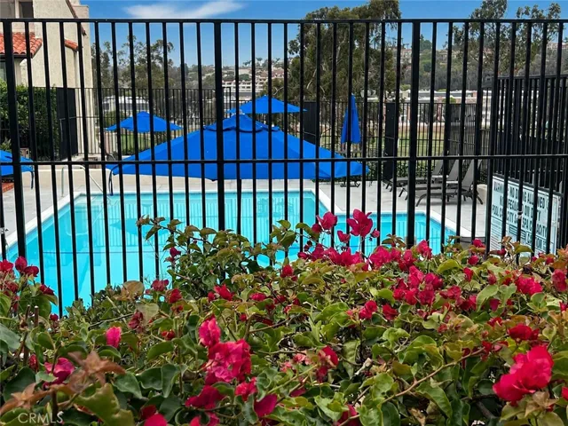 View of pool. AI enhanced blue sky.