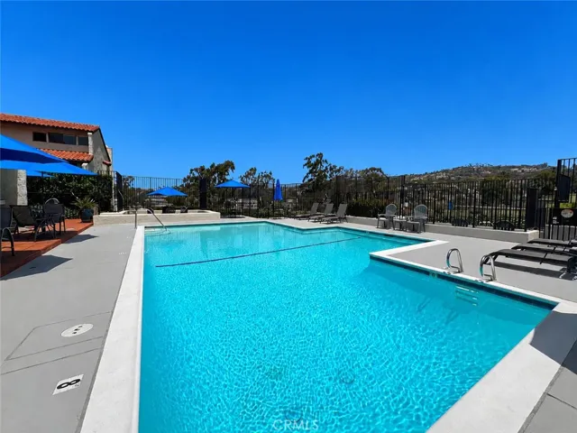 Pool decking and seating. AI enhanced blue sky.