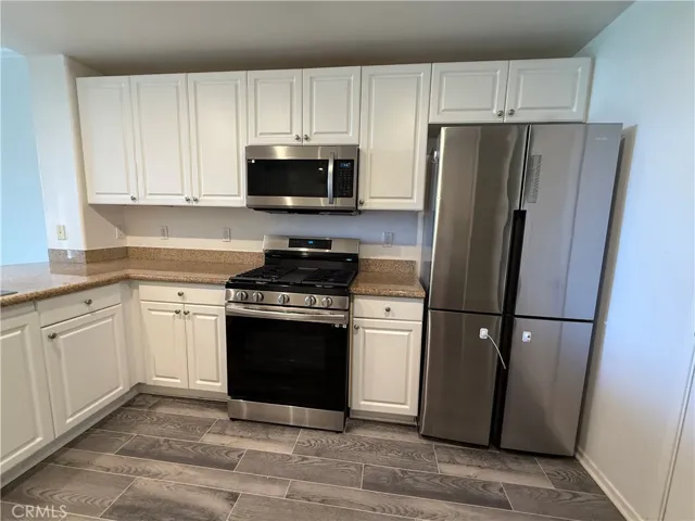 Gas range top, microwave, and refrigerator