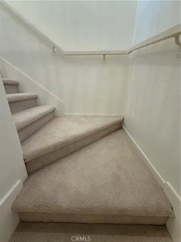 Stairs down to bedrooms