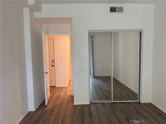 Views into the hallway and mirror closet doors