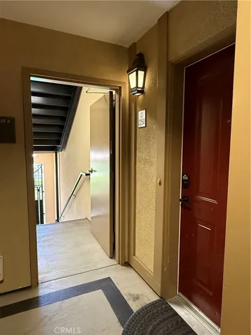 Stairs leading up from the pool to the front door