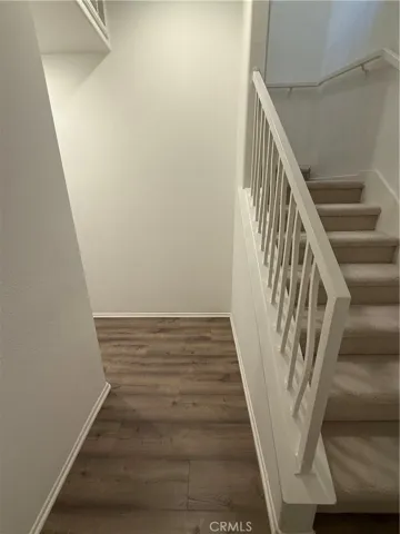 bottom stairs into hallway