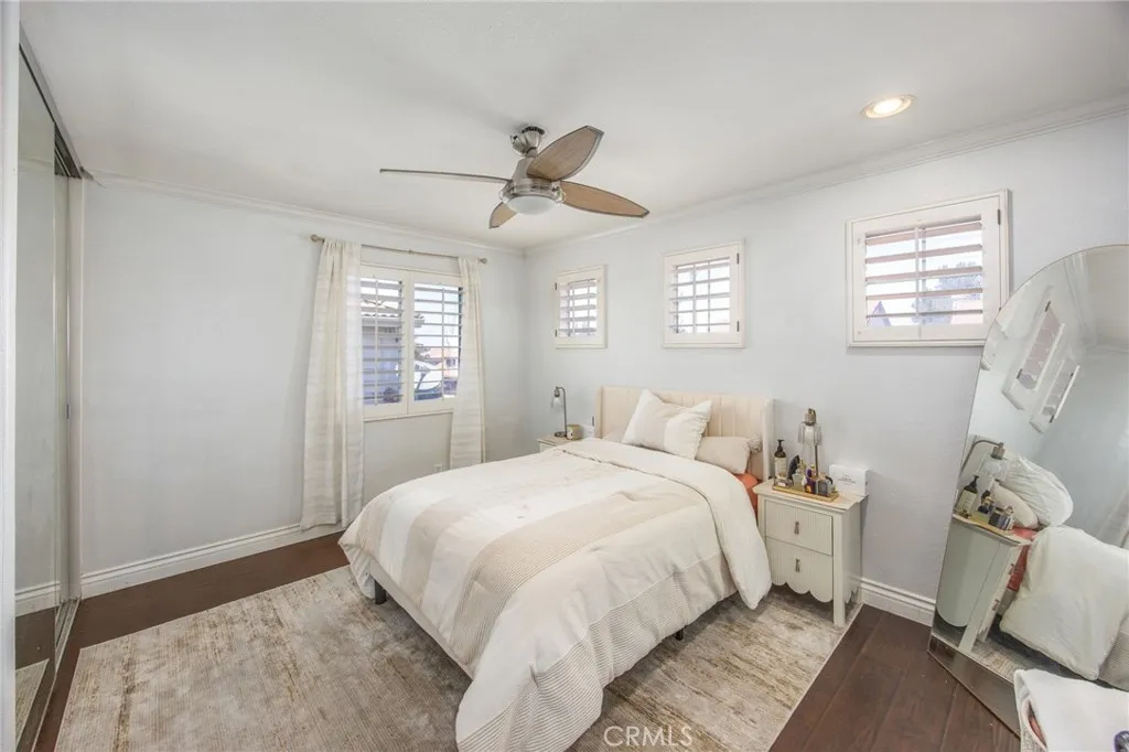 The generously sized bedroom offers a welcoming space for family or guests