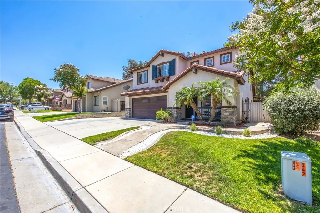 Generous driveway accommodates multiple vehicles with ease