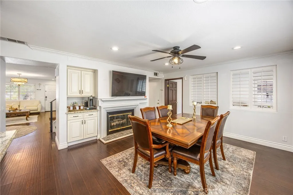 Enjoy meals beside the inviting fireplace in this open-concept gathering space