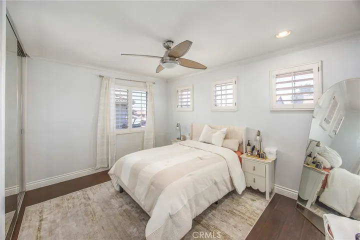 The generously sized bedroom offers a welcoming space for family or guests