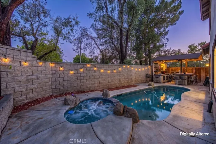 Sparkling pool and spa create the perfect setting for outdoor relaxation and entertaining