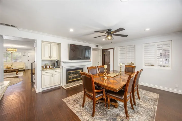 Enjoy meals beside the inviting fireplace in this open-concept gathering space