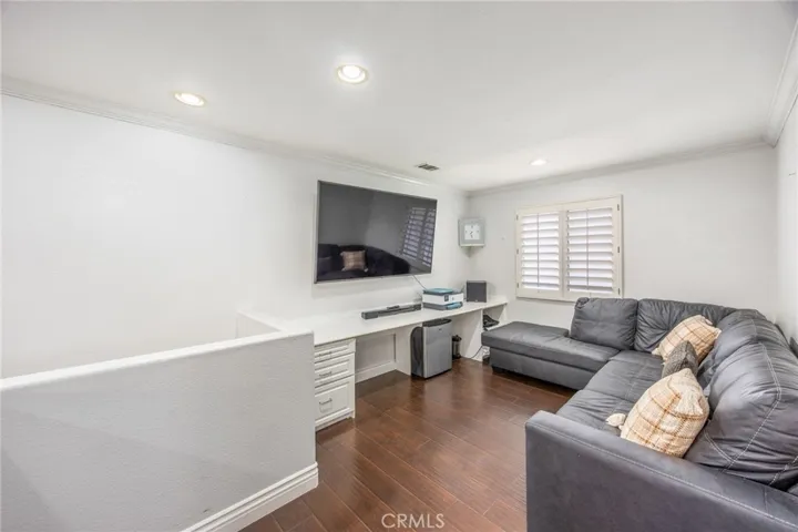 The spacious upstairs loft adds valuable living space and flexibility to the home's floor plan