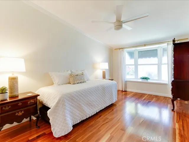 main bedroom with bay window overlooking the greenbelt