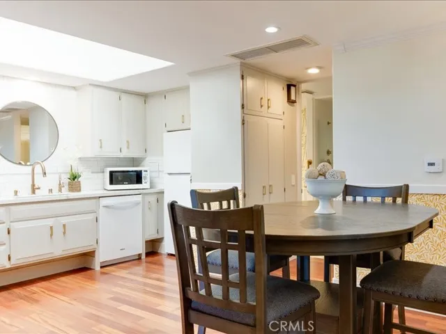 Dining area looking into the upgraded kitchen