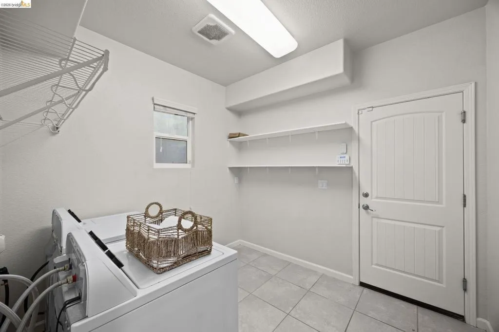 washer and dryer included. spacious and leads to garage.