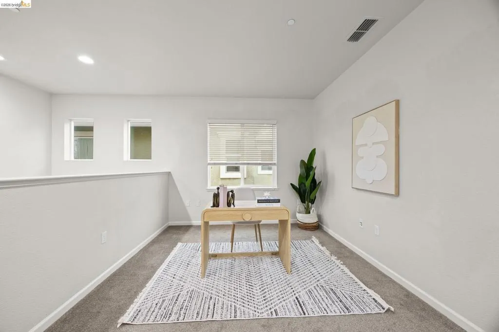 Upstairs, the versatile loft provides the perfect space for a home office, media room, or play area—offering flexibility to fit your needs.