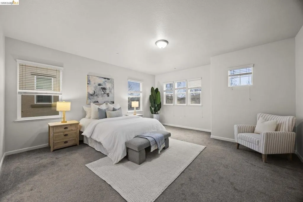 The spacious primary suite offers natural light, generous walk-in closet and plenty of room to create your own relaxing retreat.