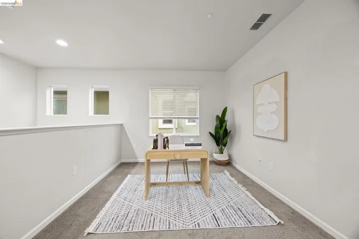 Upstairs, the versatile loft provides the perfect space for a home office, media room, or play area—offering flexibility to fit your needs.