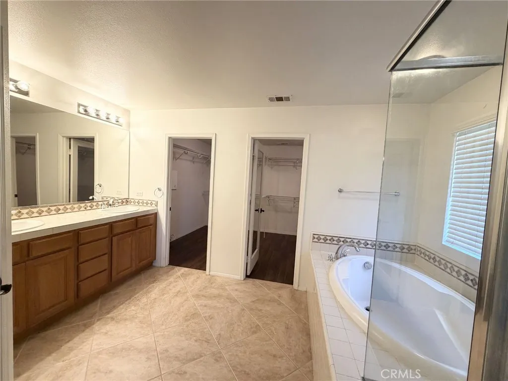 Primary Bathroom with Dual Vanities, Tub & Shower