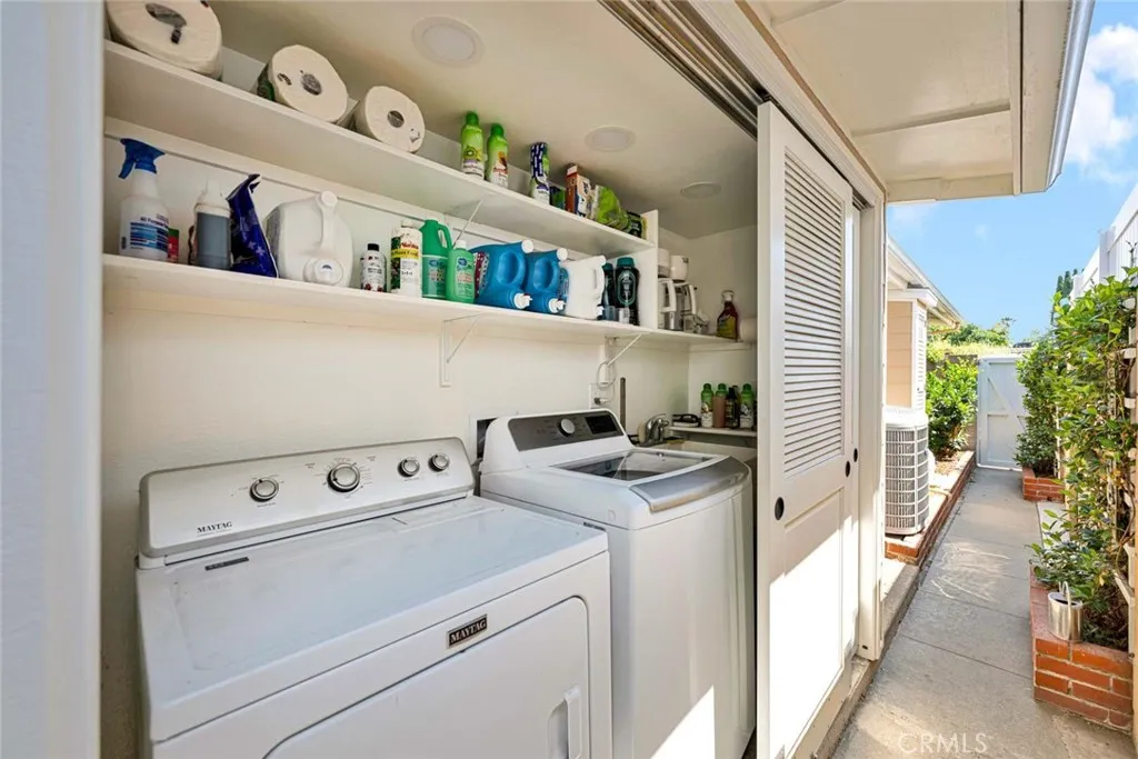 LAUNDRY AREA IS TUCKED AWAY IN THIS BACKYARD CLOSET AREA