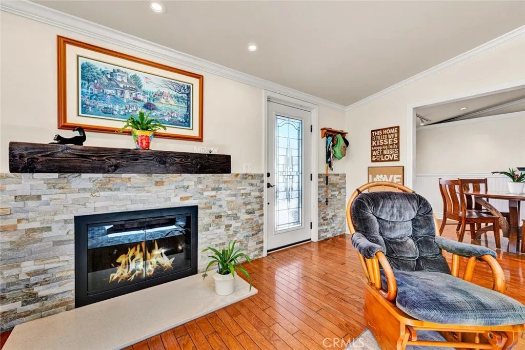 GORGEOUS STACKED STONE FIREPLACE IN THE LIVING ROOM