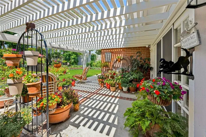 ANOTHER VIEW OF THE COVERED PATIO AREA IN THE BACKYARD
