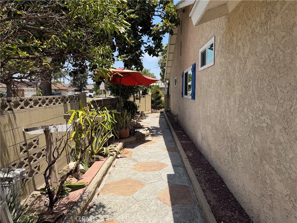 West side of house with access to the front of the house.