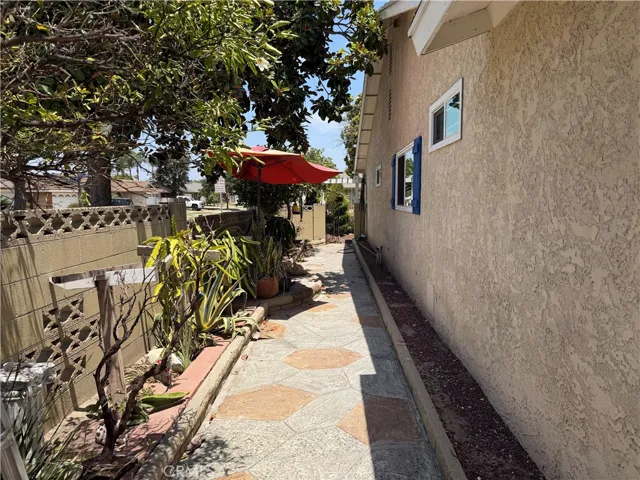 West side of house with access to the front of the house.
