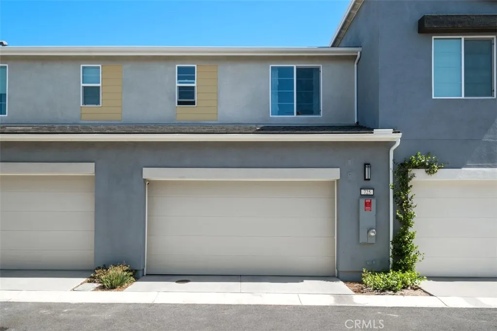 Two Car Attached Garage with EV Charger and Overhead Storage