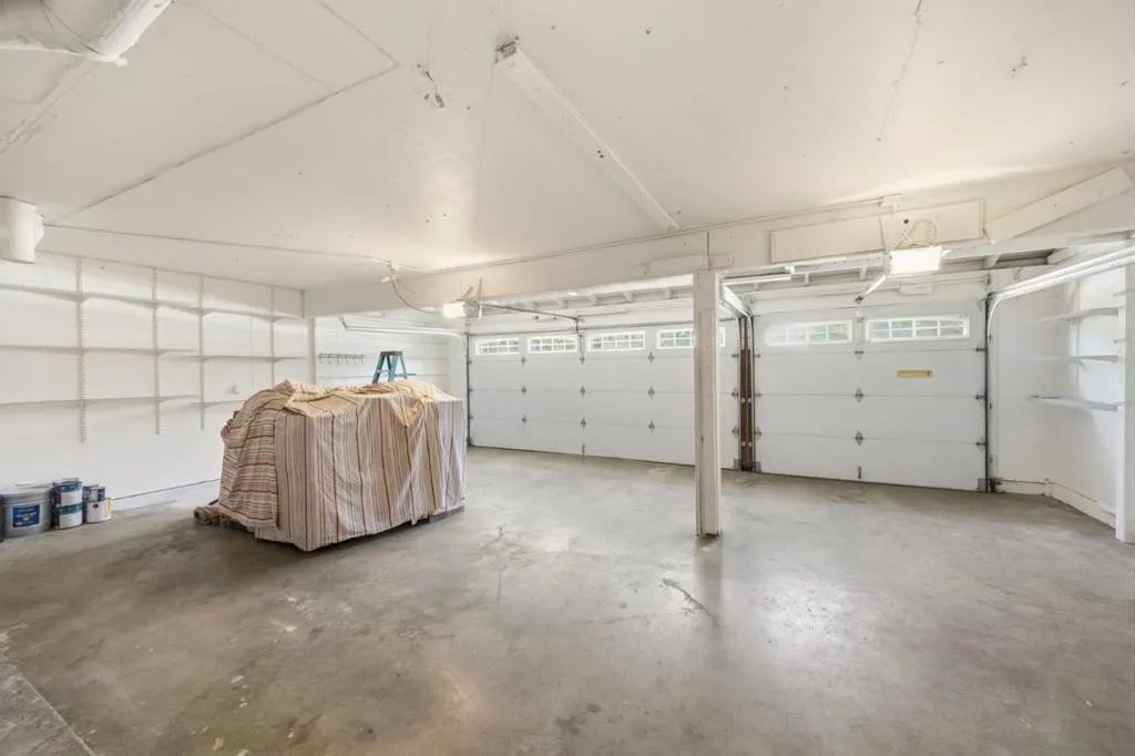 spacious 3-car garage with overhead attic or ceiling storage.