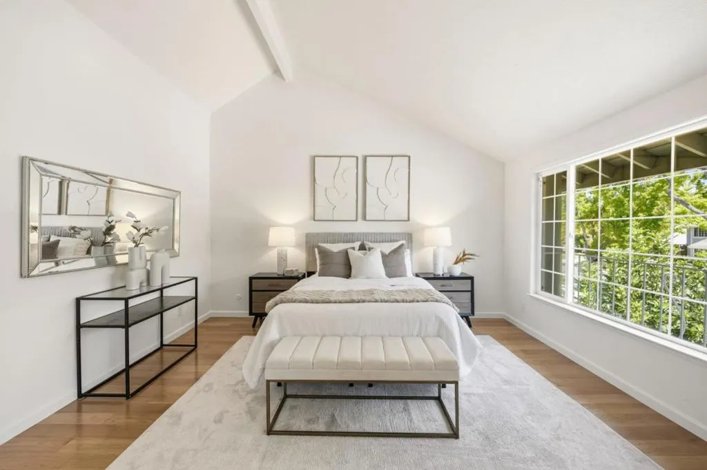 Huge primary bedroom has vaulted ceiling.