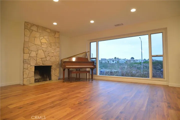 Living/great room/fireplace (piano removed/not included)