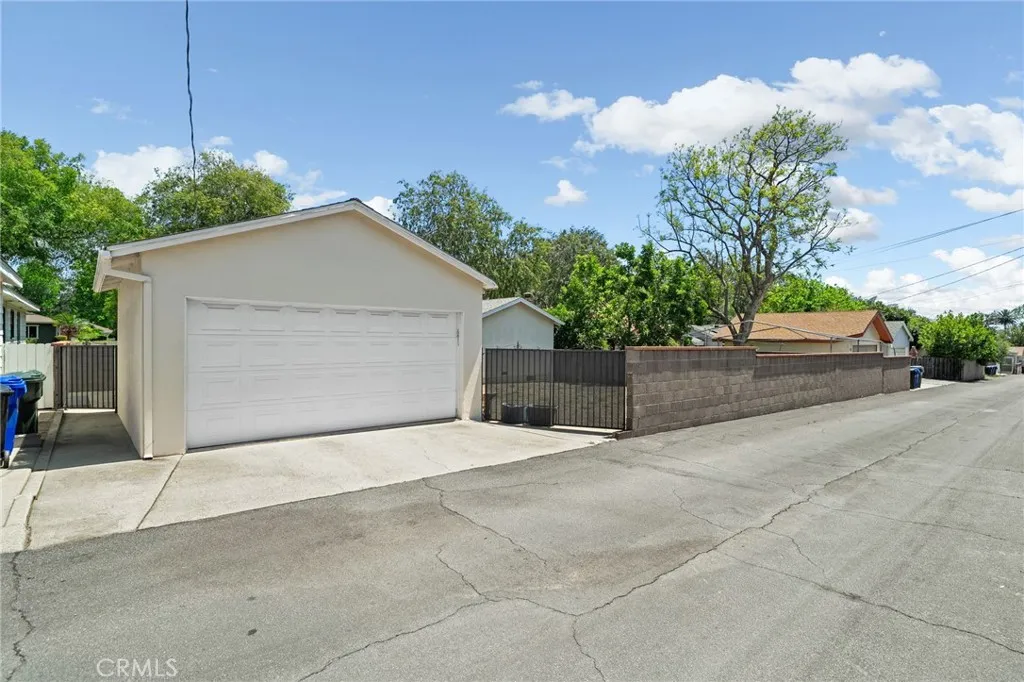 Garage Entrance on rear of property by way of a wide alley. Metal gate opens so you may park a large vehicle or have RV style access.