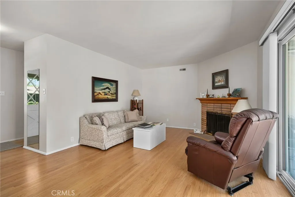 Living room with Fireplace and Slider to back Patio.