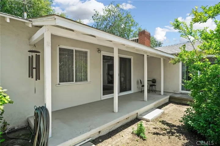 Rear Porch with dual slider access to living room and primary bedroom.