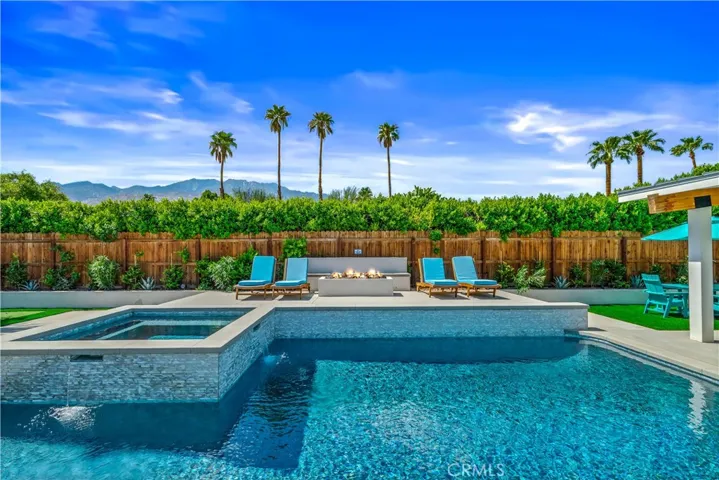 "Enjoy desert evenings poolside with a custom fire feature and resort-inspired outdoor living."