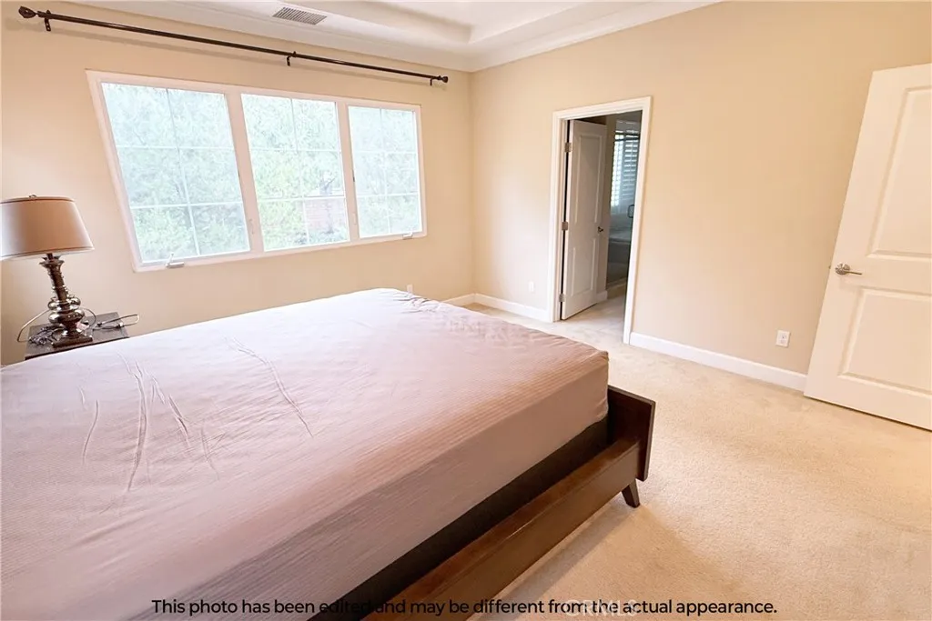 Second-floor master bedroom. A queen-size bed is included in the lease at no additional cost.