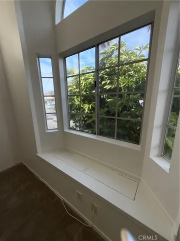Large Bay Window in Living Room Floods the Room With Light and Ocean Breezes
