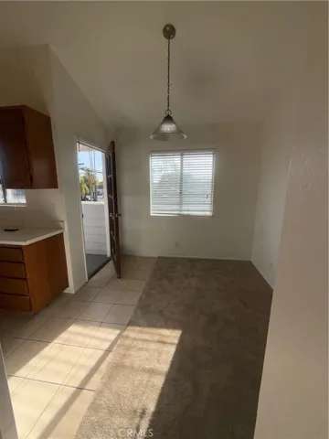 Dining Area Off Kitchen with Balcony Access