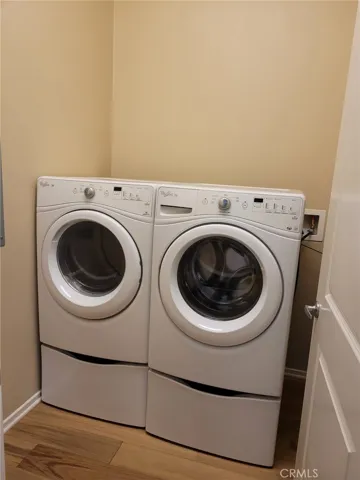 Laundry Room with Washer and Dryer provided.