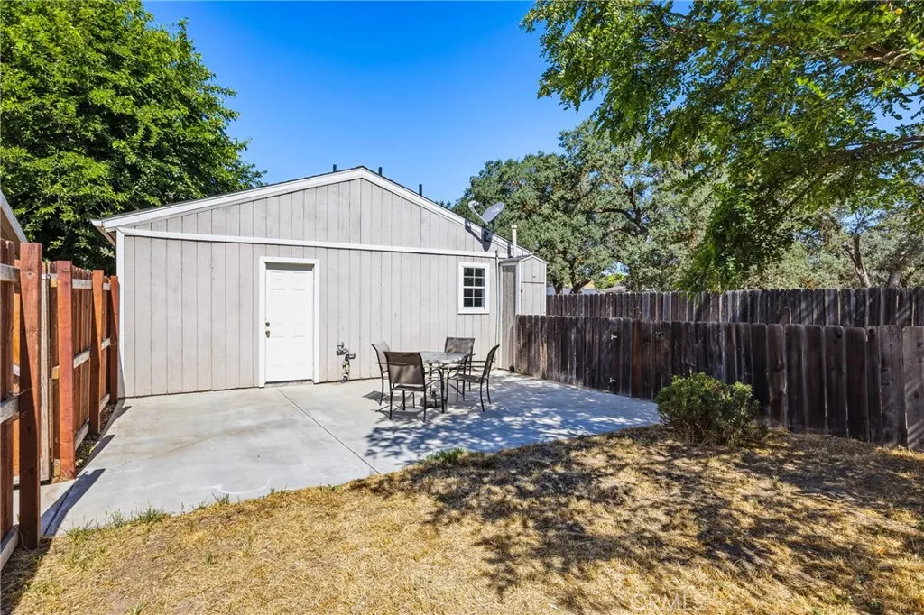 Guest House Backyard – Private fenced backyard with a spacious patio and direct access to the guest bedroom, offering a comfortable outdoor retreat.