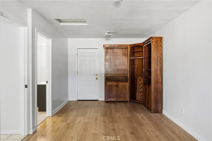 Guest bedroom offers access to the outside private fenced patio