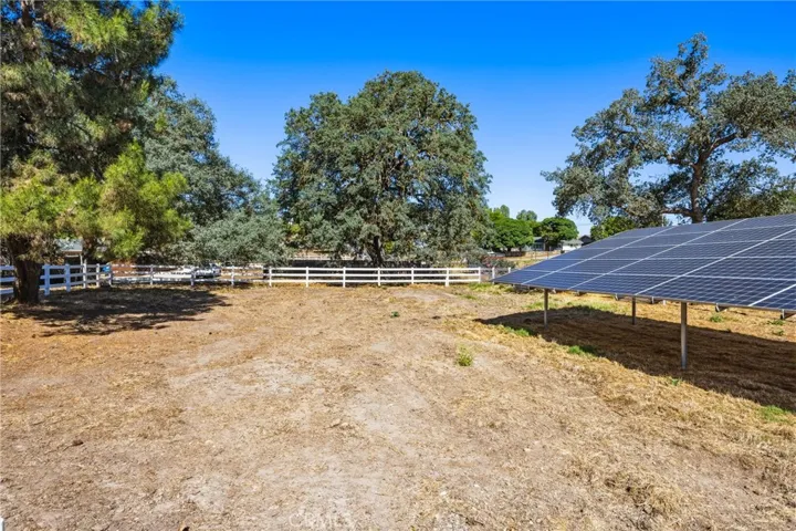 Vinyl Fenced pasture with mature trees  and solar system
