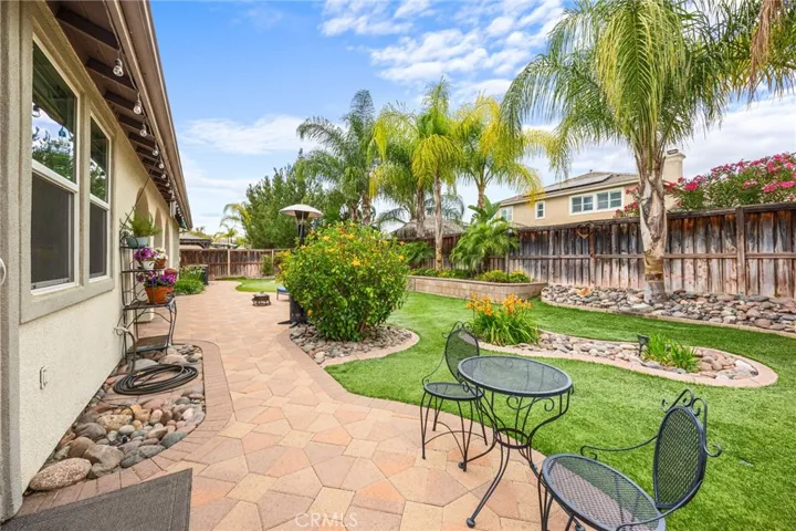 Low Maintenance Tropical Backyard with Artificial Turn, Drip Lines & custom Stone Paver Walkways