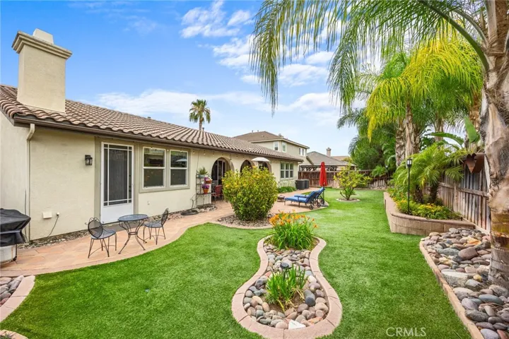 Low Maintenance Tropical Backyard with Artificial Turn, Drip Lines & custom Stone Paver Walkways