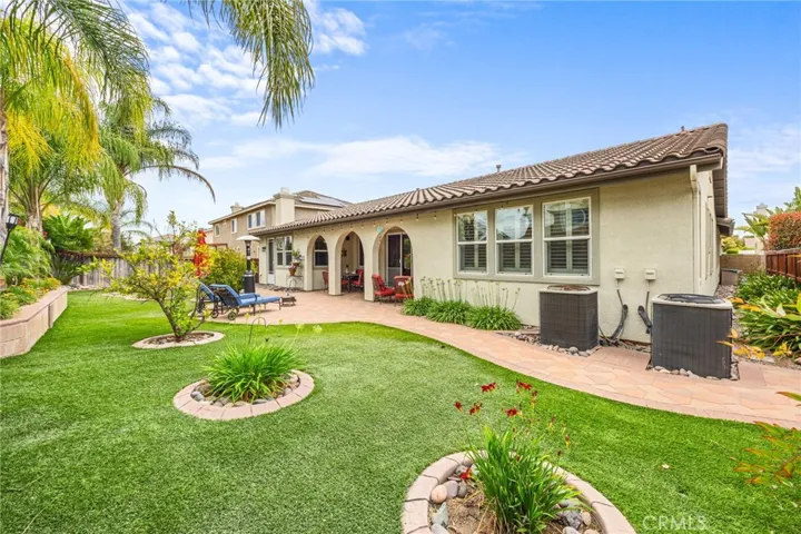 Low Maintenance Tropical Backyard with Artificial Turn, Drip Lines & custom Stone Paver Walkways