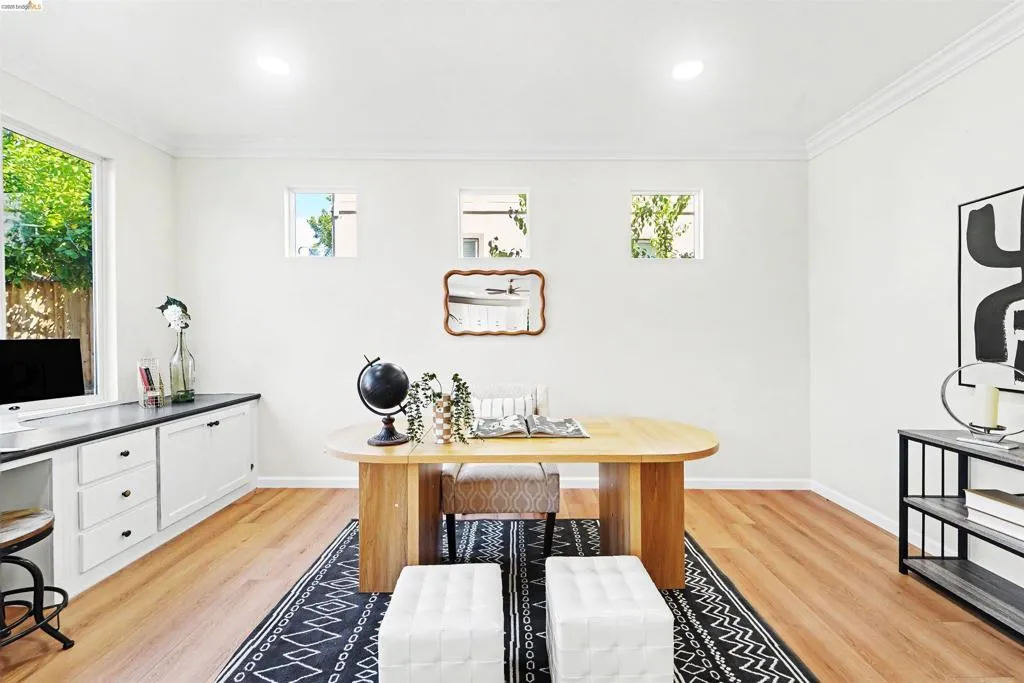 Bright interior space featuring wood-finish flooring, white walls, and recessed lighting